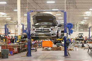 Ford F-150 Truck up on wrack during adjusters inspection